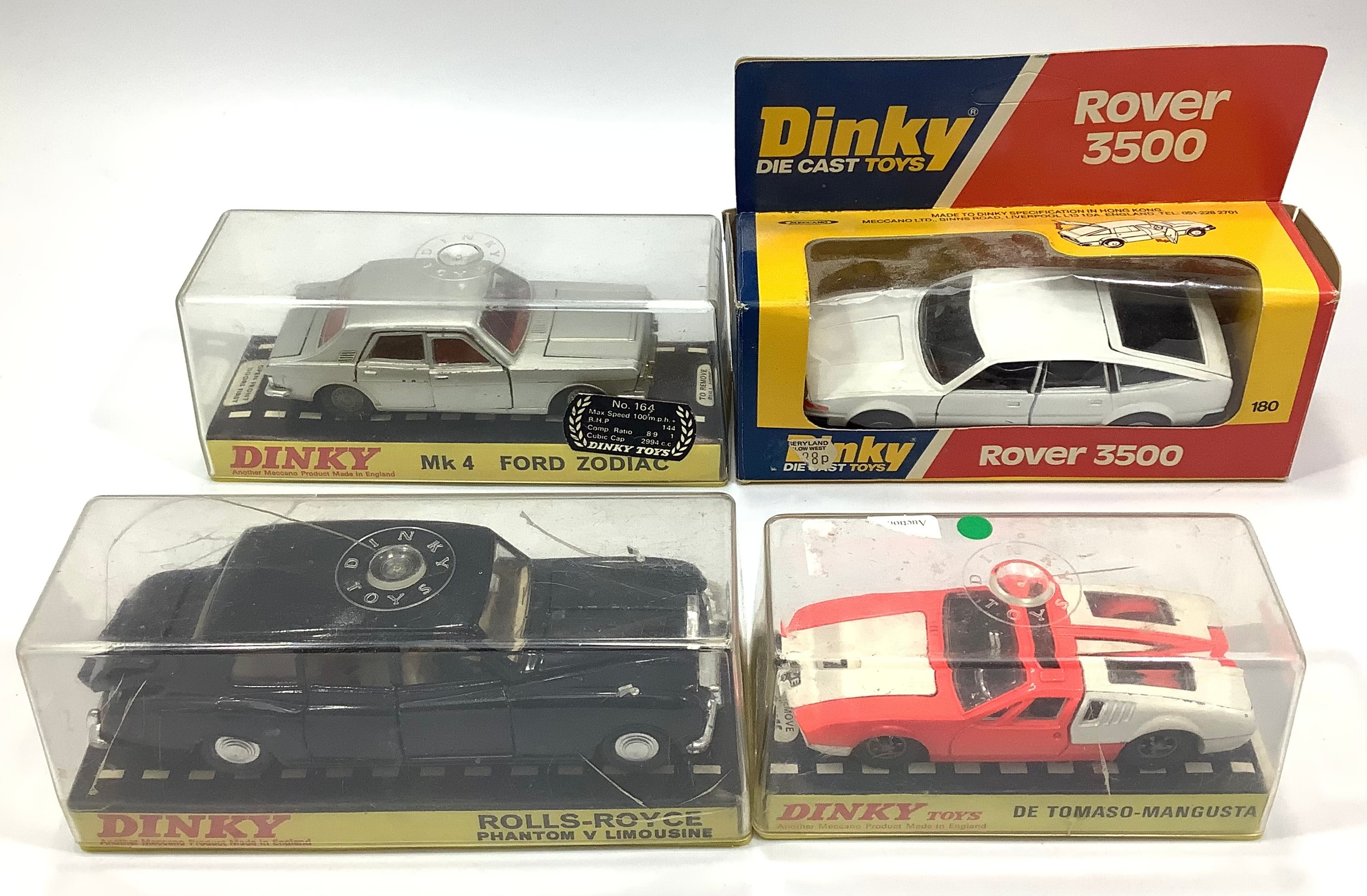 Four various Dinky Toys models including a red and white De Tomaso-Mangusta No. 187, a silver Mk 4