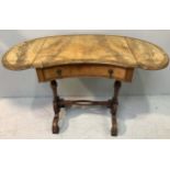 A Victorian inlaid walnut kidney-shaped sofa table, with central drawer and metal pulls, raised on