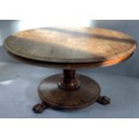 A 19th century rosewood circular tilt-top supper table inverted tapering column to circular