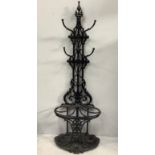 A large cast iron floor standing hall-stand by Coalbrookdale, with central acorn finial above