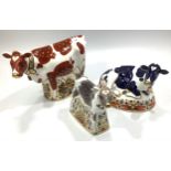 Three Royal Crown Derby paperweights, 'Friesian Cow Buttercup', 'Bluebell Calf' and 'Daisy Cow',