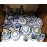 A large quantity of Wedgwood blue and white jasperware including trinket pots and covers, cup and