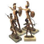 Four various bronzed figures of Spartans with swords and spears raised, on rectangular marble bases,
