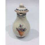 An 18th century sparrow beak jug and cover, with intertwined handle and painted in polychrome
