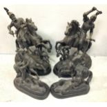 A pair of large black painted spelter figures of knights on rearing horses, 48cm high, together with