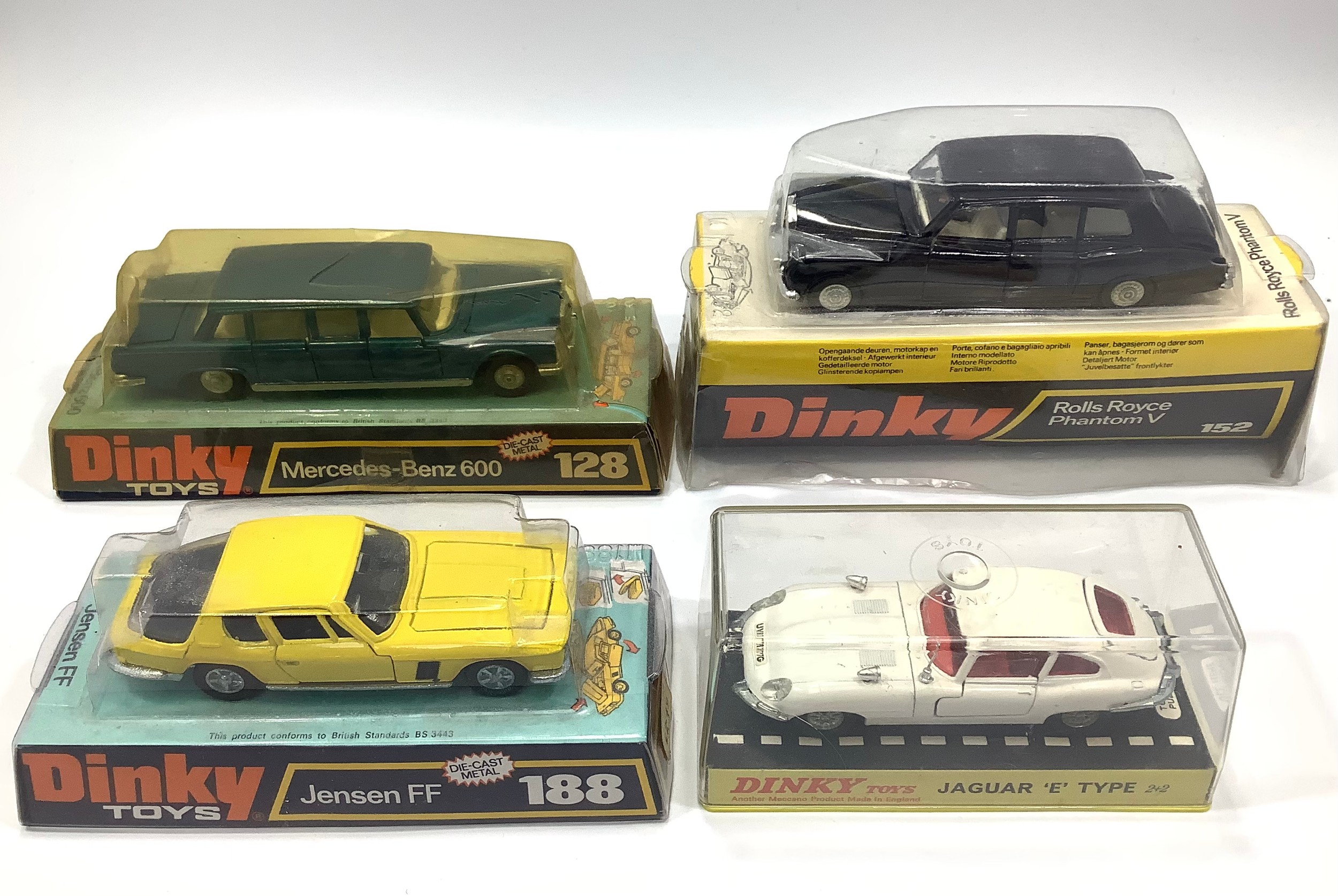 Four various Dinky Toys models including a black Rolls Royce Phantom V No. 152, a metallic blue