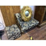 A child's chaise lounge with black and gold floral upholstery, 90cm long, together with a small