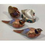 Four Royal Crown Derby paperweights including a swan, two Pheasants and a cockerel, each with