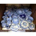A large quantity of Wedgwood blue and white Jasperware including teapot, jug, numerous trinket