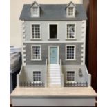 There is no dolls house furniture with this lot. A large Georgian style double-fronted dolls house