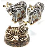 Three Royal Crown Derby 'Zebra' paperweights, each with printed marks to base and gold stoppers, all