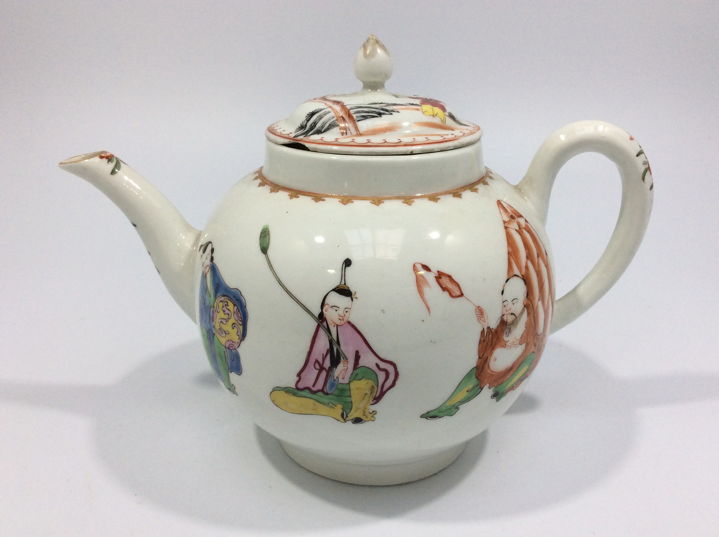 An 18th Century Worcester Teapot, of globular form with dome cover, finial and plain handle,