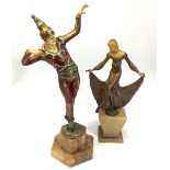 An art deco style figure of a male dancer painted in green, red and gilt, in the Chiparus style,