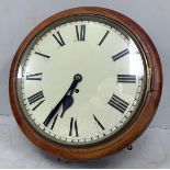 A mahogany cased circular wall clock, the white dial with Roman numerals denoting hours and with
