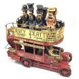 A novelty model of an open-topped double decker bus with seated figures in Victorian dress top and