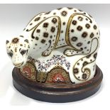 A Royal Crown Derby paperweight, 'Snow Leopard', exclusive from Connaught House, with printed