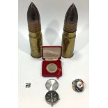 A pair of British approx. 45mm brass and copper military rounds by Elswick Ordnance Company,