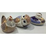 Three Royal Crown Derby paperweights, a chicken, a duck and an owl, each with printed marks to bases