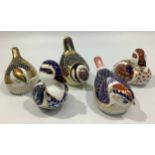 Five assorted Royal Crown Derby paperweights modelled as birds, including a 'Collectors Guild