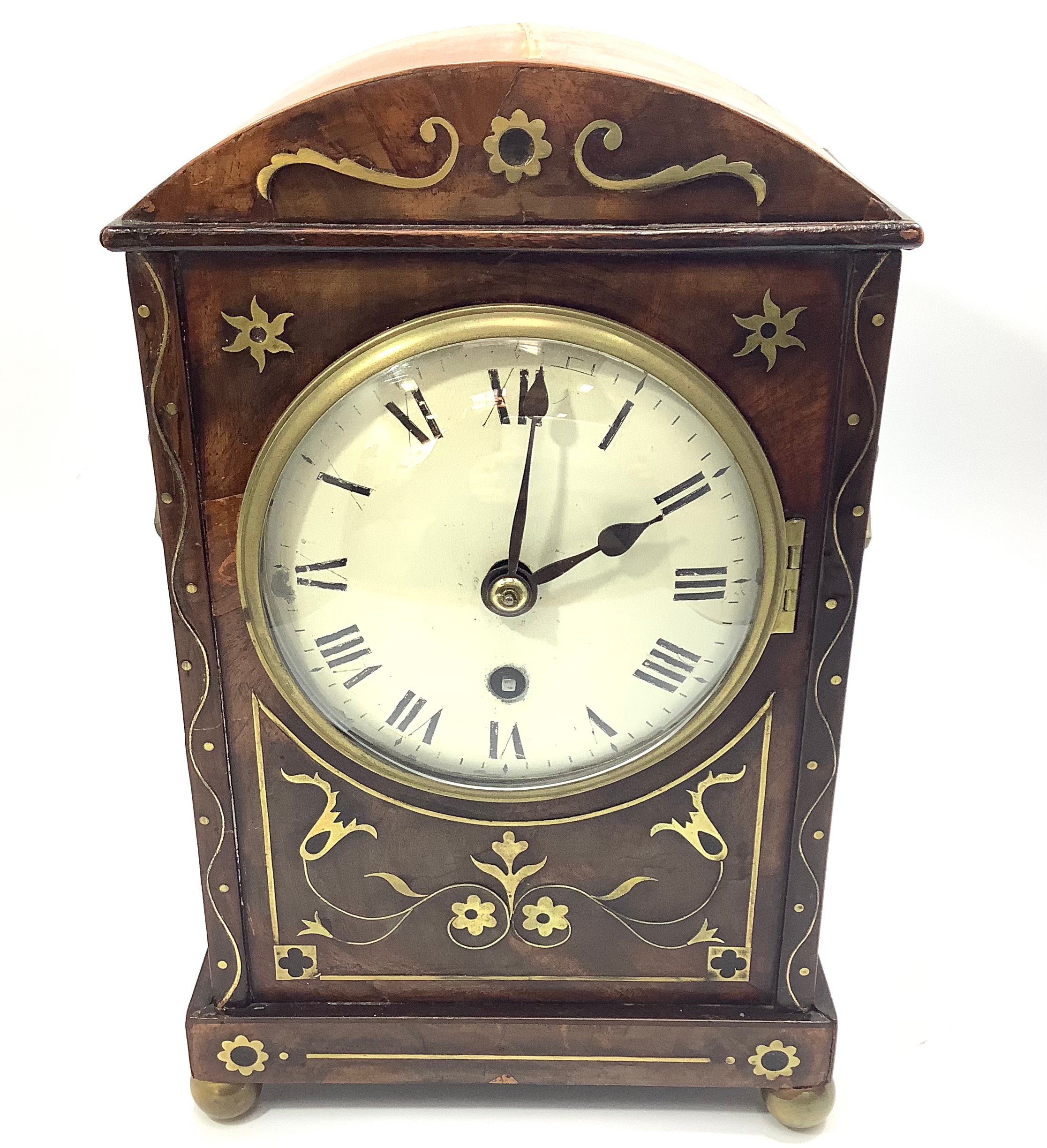 An Edwardian walnut and brass inlaid mantel clock with single fusee movement, white enamel dial with