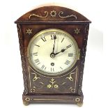 An Edwardian walnut and brass inlaid mantel clock with single fusee movement, white enamel dial with