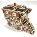 A Royal Crown Derby paperweight, 'Old Imari Caravan', with printed marks to base and gold stopper,