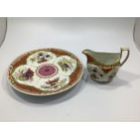 A Chamberlain's Worcester plate and matching cream jug decorated in 'Dragon in compartments'