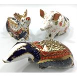 Three Royal Crown Derby paperweights, 'Reindeer', 'Moonlight Badger' and 'Sitting Pig', all with