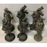 Two large spelter figures of Cavaliers with swords aloft, on different bases, together with four