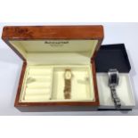 A ladies 9ct gold Accurist wristwatch, the oval yellow dial with applied gold batons denoting hours,