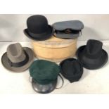 A WWII cap with RAF Officer's Economy cap badge, together with a green military cap, a bowler hat by