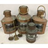 Four copper ships lamps of varying sizes, all with labels for Port, Starboard and Masthead etc.