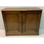 A 19th century walnut two door standing cupboard with pair of doors enclosing shelves, Approx. 125cm