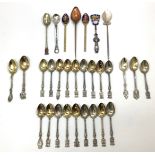 A quantity of silver souvenir teaspoons from various countries, with coats of arms or crests, and