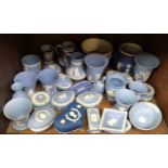 A large collection of Wedgwood blue and white Jasperware including plant pots, trinket pots and