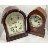 A mahogany cased mantel clock with arched top, silvered dial with Roman numerals, slow-fast and