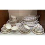 A Minton porcelain 'Spring Bouquet' part dinner and tea service comprising six-each cups, saucers,