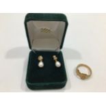 A 9ct gold buckle ring, together with a pair of 9ct gold and pearl earrings, gross weight