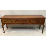 An 18th century oak dresser, with three frieze drawers with crossbanding, brass handles and