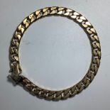 A 9ct gold close-curb link bracelet, weighing 31.2 grams, measuring 8.5 inches in length.