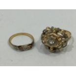 Two yellow metal (test as 18ct gold) rings, both centrally set with white stones, gross weight