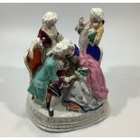 A 19th century continental porcelain conversational figure group inkwell painted in polychrome