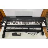 An 88-key Roland FP-7 Digital Piano in black with stand, 135cm, together with power lead and sustain