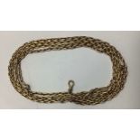 A yellow metal, tests as 9ct gold or above, long, chain link, double Albert chain, with single dog