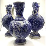 A garniture of three German 'Westervald' stoneware pottery vases in the renaissance style, the
