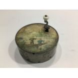 A Victorian mechanical circular music box, the top wiht a scene of two men fishing from a boat,