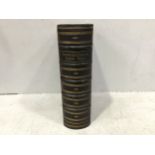 A large black leather bound 'Comprehensive Family Bible,' with raised banded spine, gilt-tooled
