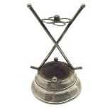 An Edwardian silver 'golf' hatpin cushion, with pair of crossed over golf clubs and four