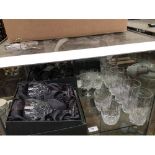 A collection of assorted Waterford crystal drinking glass comprising three boxed wine glasses,