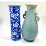 A Chinese porcelain tall cylindrical vase with fared rim, painted with 'blue ground prunus blossom,'